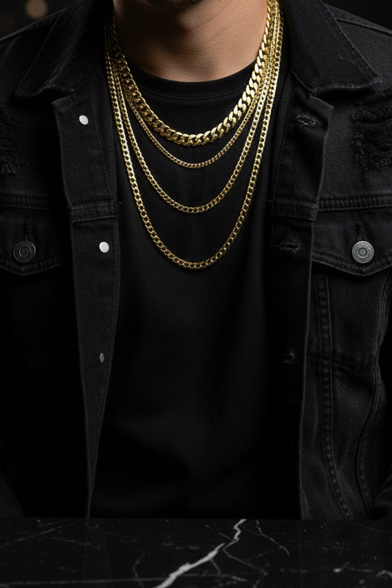 Gold chain necklace with measurements on a black stand